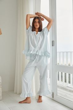 Description Ruffles galore, our Sophie Pajama Set brings effortless glamour to your downtime. Unwind and recharge in style. Relaxed style fit Button down top, maternity friendly Cropped length pants with a comfortable elastic & drawstring & pockets 100% Cotton, pre-washed and softened Sizing Ruby is wearing size S, and is an Australian size 6-8, US size 2-4, approx 5'7 tall. Neve is wearing size S, and is an Australian size 8-10, US 4-6, approx 5'8 tall. Relaxed style fit. The following guidelin Resort Wear Men, Gathered Sleeves, Sleep Set, Cotton Set, Bridal Shop, Stretch Pants, Something Blue, Relaxed Style, Cotton Bag