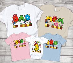 three t - shirts with the word dad and two children's tshirts