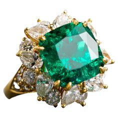 The Colombian Emerald has always been the most desirable of all the emeralds and this one is no exception. Crafted in 18k yellow gold featuring one square cushion Colombian emerald weighing 8.39ct and has minor to moderate clarity enhancement. The center stone is surrounded by eight pear shaped diamonds and twenty four round diamonds weighing approximately 5.25 cttw with F/G color and VS clarity. Ring size 8. The emerald has a very deep and rich color and comes with an AGL report. This ring is an absolute stunner and will be an excellent addition to a buyers jewelry collection. Emerald Aesthetic, Emerald And Diamond Ring, Diamond Cocktail Ring, Emerald Diamond Ring, Sparkly Jewelry, Colombian Emeralds, Diamond Cocktail Rings, Pear Shaped Diamond, Emerald Jewelry