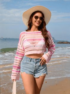 Introducing the Novalie Cover Up Pullover Sweater in a pink doll color. Perfect for summer days, this crochet knit sweater features a unique stripe pattern, adding a playful touch to any outfit. Stay cozy and stylish with this must-have piece! Size Guide: Model is 5’8” tall, and has a 34.2” bust, 24.9”waist, & 37.5” hips. She is wearing a S / US 4 / AU 8. This crop top is true to size. Material: 100% Acrylic. Key Features: Crochet Knit Fabrication. Stripe Pattern. Long Sleeves. Crop Length. Relaxed fit. Care Instructions: Machine wash / Cold hand wash Dirndl Outfit, Bandeau Tops, Mini Robes, Maternity Swimwear, Maxi Dress Formal, Loungewear Sets, Swimwear Cover, Monokini, Pink Sweater