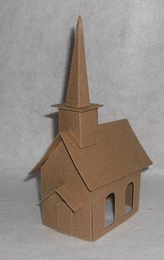 a paper model of a church with a steeple on it's roof and windows