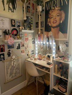 a room with many pictures and lights on the wall