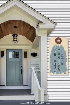 the front door of a house with a welcome sign