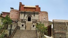 an old building with stairs leading up to it