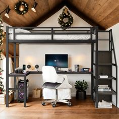 a loft bed with desk underneath it and christmas decorations on the wall behind it,