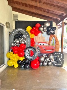 cars birthday party decoration with balloons and streamers