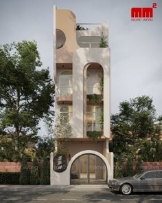 a car is parked in front of a tall building with balconies on it