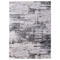 an abstract rug in grey and white tones