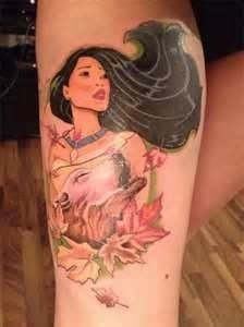 a woman's leg with tattoos on it