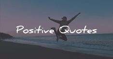 a person jumping in the air with their arms spread out, while holding onto an object that reads positive quotes