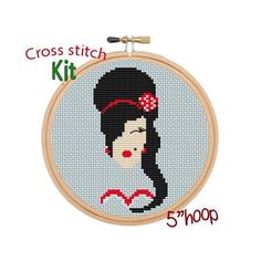 the cross stitch kit is ready to be sewned and hung in a hoop