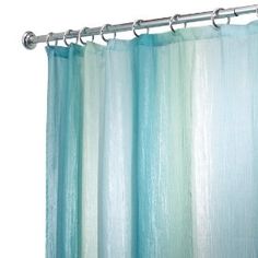 a shower curtain with blue and green striped curtains on it's rod, in front of a white background