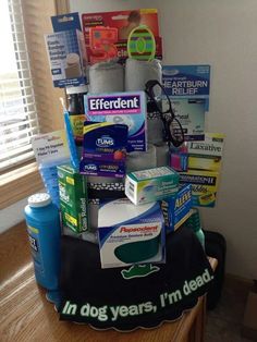 a pile of medical supplies sitting on top of a wooden table next to a window