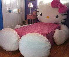 a hello kitty bed in the corner of a room