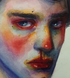 a painting of a man's face with red and yellow paint on his face