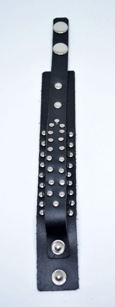 Genuine mens black leather studded bracelet with adjustable snap closure at the end. High quality handmade item, suitable for a modern urban look. Fits both men and women. Fit wrists from: 17 cm (6.69") 19 cm (7.48") to 22 cm (8.66") Width is about 3 cm (1.18") Studded Bracelet, Mens Leather Bracelet, Urban Looks, Mens Black Leather, Modern Urban, Mens Leather, Leather Men, Snap Closure, Mens Gifts