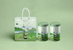 two canisters are sitting next to each other on a green surface with a bag