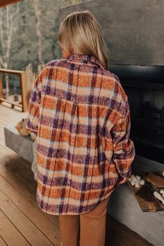 - Raise a toast to cozy season in this warm jacket! - Unlined material with a rust, blue, and purple hued plaid - A collared neckline - A button-up front - Long, loose sleeves - Functional chest pockets as well as side pockets - A relaxed silhouette that ends in a rounded hemline Measurements 1XL : Bust 56", Hip 58", Length 34", Sleeve Length 22.5", Waist 57". 2XL : Bust 58", Hip 60", Length 34.5", Sleeve Length 22.5", Waist 59". 3XL : Bust 60", Hip 62", Length 35.5", Sleeve Length 23.5", Waist Orange Button-up Winter Outerwear, Orange Button-up Outerwear For Winter, Purple Collared Winter Outerwear, Long-sleeved Rust Outerwear For Winter, Rust Long Sleeve Outerwear For Fall, Cozy Orange Long Sleeve Outerwear, Cozy Orange Outerwear For Fall, Collared Jacket, Cozy Season