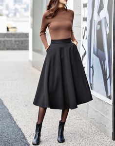 "Classic black skirt，Never go out of style，Lean and versatile. simple and elegant style suits wearing every occasion, working, shopping, weekend..soft and breathable fabric will let you act freely. Wear them with your favorite tops, such as short sleeves, suspenders, coats, and shirts...etc DETAILS: * 90% cotton, others are polyetser * Polyester lining * Two side pockets * Right zipper closure * High waistband * Elastic back waist * Black Circle skirt * Retro skirt * Perfect for spring and summer * Learn More about the items From the FAQs on the page bottom * The model is 170cm (5′7″) tall with a 80cm (31.5\") bust, 66cm (26\") waist. She is wearing in size XS. CUSTOM MADE SERVICE If you * Change other color * Can't find your size in our size Chart * Change the length * Your Height is not Circle Skirt Work Outfit, Black Skirt Combination, Circle Skirt Midi, Black Winter Skirt Outfit, Black High Waisted Skirt Outfit, A Line Work Skirt, Styling A Line Skirt, Gored Skirt Outfit, Black Skirt Business Casual