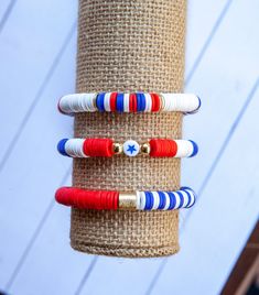 "These fun bracelets are perfect for celebrating America and the Red White and Blue that we love. You can choose between just 1 of the bracelets or go for the stack of 3. All bracelets are 8mm. Choose between... -Color Block Bracelet with gold disc accents -Red White and Blue Bracelet with Gold hematite balls and a fun blue star -Blue and White Stripe with the other half solid red. Accented with gold plated barrel bead. -Stack of 3 ~SIZING: -Please measure your wrist before choosing a size. Usin Adjustable White Bracelet For 4th Of July, White Round Bead Bracelets For 4th Of July, White Beaded Bracelets For 4th Of July Gift, White Round Beads Bracelets For 4th Of July, 4th Of July White Beaded Bracelets Gift, White Patriotic Bracelet As Gift, Adjustable White Beaded Bracelets For 4th Of July, Patriotic White Stretch Bracelet As Gift, White Bracelets For 4th Of July Gift