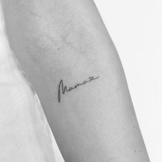 a woman's arm with the word mama written in cursive handwriting