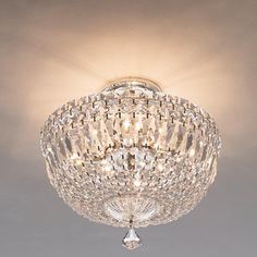 a crystal ceiling light fixture in a room