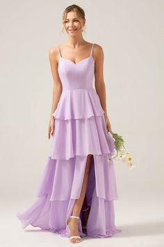 a woman in a long purple dress