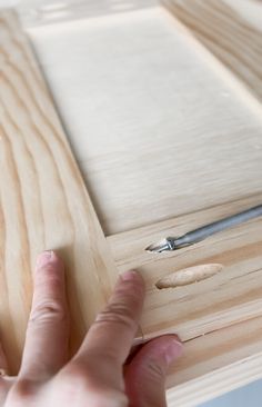 a person is working on a piece of wood