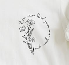 a white t - shirt with black lettering and flowers on the front, which reads if you never heard your name