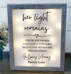 a framed sign with the words, her light remains there are some who bring a light to the world that even after they have gone