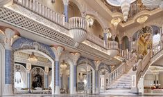 an elaborately decorated lobby with chandeliers and marble floors