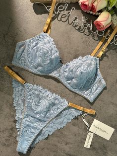 Experience elegance with our light blue lace lingerie set. Delicate embroidery and soothing blue hues create a fresh, comfortable ensemble. Adjustable yellow straps add a touch of style. Embrace comfort and charm in every wear. 🌸💙 Material: Made of 95% polyester, 5% spandex. Exquisite Embroidery Design: The lingerie set features intricate embroidery, adding delicate patterns for an alluring appeal. Comfortable and Form-Fitting: Lightweight Padded-free Underwire Bra. Crafted from soft and smoot Honeymoon Trip, Lingerie Party, Delicate Embroidery, Lace Lingerie Set, Fishnet Stockings, Blue Soft, Red Lingerie, Intricate Embroidery, Lace Lingerie