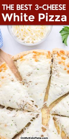 the best 3 - cheese white pizza with parmesan cheese on top is cut into four slices