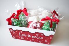 a red and white box filled with christmas treats