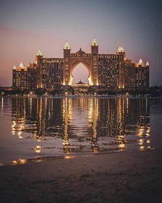 a large building sitting on top of a body of water