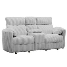 the reclining sofa has two pillows on it's back and is made from fabric