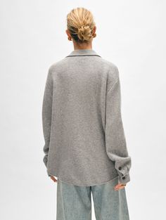 The season’s interpretation of the shacket is both incredibly cool and luxurious. The silhouette is reminiscent of a well-loved flannel shirt, while our luxe cashmere delivers a structured yet fluid drape. Front flap pockets complete the design. Team the oversized knit with a white tee, straight-leg jeans and ankle boots. Details Oversized fit. Long sleeve. Length in size small is 16 3/4". The model is 5'8" and is wearing a size small. 100% Cashmere. Dry clean only. Style #20785 Cashmere Button Top For Fall, Fall Cashmere Top With Buttons, Cashmere Tops With Buttons For Fall, Classic Single Breasted Tops For Fall, Fall Cashmere Tops With Button Closure, Oversized Fall Top With Concealed Placket, Oversized Top With Concealed Placket For Fall, Fall Wool Button-up Top, Wool Button-up Tops For Fall