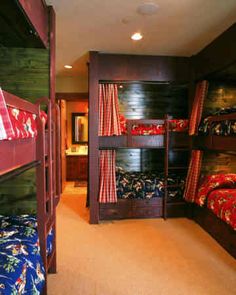 a room with bunk beds and curtains in it