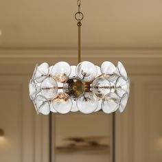 a chandelier hanging from a ceiling in a room