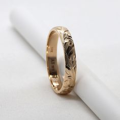 14K Gold Wedding Band, perfect for couples who love Hawaiian tropical flower and scroll design. 100% handmade. Engraved with Hawaii's Plumeria flower and scroll. Handmade with 14K gold. Ring width is 4mm. Barrel shape. Lovin' Hawaii Jewelry Features Made to Order. Handmade in Hawaii. Hand engraved design. Gold Karat: 14 Karat Available Gold Color: Rose Gold / Yellow Gold / White Gold Ready to Ship in 5 Business Days from HAWAII. Free inside message engraving. To make the piece more personal, you Yellow Gold Engraved Ring For Wedding, Gold Engraved Bands For Marriage, Hawaiian Wedding Ring, Hawaiian Wedding Band, Gold Hawaiian Wedding Ring, Hawaiian Wedding Rings, Hawaiian Heirloom Jewelry, Hawaii Jewelry, Wedding Band Engraving