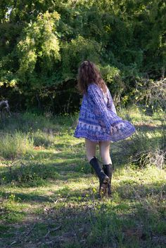 Our beautiful Sienna dress with its signature Blue Boheme silhouette and beautiful blue color is an unforgettable beauty and the ultimate bohemian glamour.Sizes: SM & ML100% Cotton | Color: Liberty BlueModel Height: 5'7Bust: 32BWaist: 24Hips: 32 Boho Print Free-spirited Dresses, Hippie Blue V-neck Dress, Free-spirited Tunic Dresses For Spring, Free-spirited Spring Tunic Dress, Blue Boho Beach Dress For Fall, Peasant Boho Dress For Beach In Fall, Flowy Free-spirited Boho Dress For Spring, Flowy Free-spirited Spring Dress, Peasant Style Boho Dress For Beach In Fall