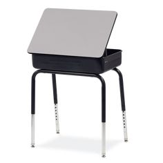 a black and white desk with a laptop on it's back legs, against a white background