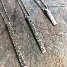 Each of these elongated bar necklaces is created by cutting, forming, and hammering pure sterling silver entirely by hand. Each pendant is suspended from a Sterling Silver chain. Be sure to see all photos and video for accurate size reference. Select your desired finish, bar length, and necklace length when ordering. Bar Necklaces, Metal Jewelry Making, Silver Bar Necklace, Hammered Sterling Silver, Silver Bar, Bar Pendant, Silver Bars, Earth Friendly, Eco Conscious