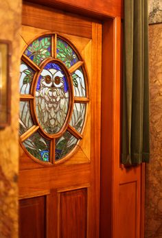 an owl stained glass window on the front door