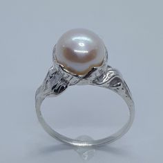 This handmade, beautiful Pearl ring has been expertly crafted in warm 925 sterling silver and authentic pearl . This gorgeous ring will make a great special occasion/ birthday gift. All of my jewelry is handmade from scratch, one item at a time as I like to make sure I am producing a high quality item. A tracking shipping number will be provided to you once the ring has been shipped. Pearl measurements:  White Pearl: 8.5 mm Ring size : 6 3/4 Ring Weight: 3.7 grams Ring Band at smallest point: 1. Fine Jewelry Pearl Ring With High Luster For Gift, Handmade White Gold Pearl Ring For Formal Occasions, Classic High Luster Silver Ring, Hallmarked Sterling Silver Pearl Ring For Gift, Silver Rings With Pearl Drop In Fine Jewelry Style, Silver Pearl Drop Ring For Anniversary, Formal Silver Pearl Ring With High Luster, Formal High Luster Silver Pearl Ring, Hallmarked Sterling Silver Pearl Ring For Anniversary