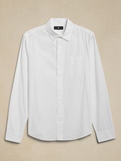 This shirt is cut from our new cotton poplin, one we love for its polished appearance and subtle sheen.  Each piece undergoes a special wash process to add a luxurious softness and an elevated-yet-casual look.  Standard fit.  Spread collar with button front.  Chest pockets.  Straight hem.  Standard fit.  Long sleeves.  Hip length.  Model: Size M, 6'2" (188cm). White Shirt Men, White Button Down Shirt, White Button Up, Cotton Poplin Shirt, White Shirt Dress, Poplin Shirt, Hip Length, Cotton Poplin, White Shirt