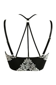 UnderwiredNon-paddedLongline bralette shapeFront fastening hook and eye detailsBeautiful two-tone floss laceRacer-back styleAdjustable strapsWorn to be seenDecorate your body in luxurious lace with the India Two-Tone Floss Front Fastening Bralette. This underwired, racerback style features a supportive and stylish hook-and-eye fastening as well as adjustable straps. Worn as a beautiful set or worn to be seen with your favourite jeans or skirt, this tantalising non-padded bralette can be more sty Underwire Crop Top With Adjustable Straps, Fitted Lace Bra With Spaghetti Straps, Lace Crop Top With Adjustable Spaghetti Straps, Push-up Bra With Lace Closure For Party, Lace Push-up Bra With Straps, Elegant Underwire Crop Top With Straps, Elegant White Bra With Spaghetti Straps, Elegant White Crop Top With Adjustable Straps, Elegant Crop Top With Built-in Bra