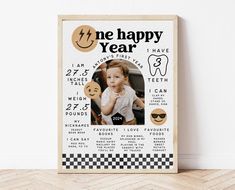 a wooden frame with an image of a baby's first year and the words happy new year on it