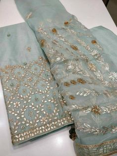 Item Overview ATHARVA Hand Embroidered Salwar Kameez w/Embroidery Panel Blue w/Gota Patti Chiffon Dupatta/Custom Stitch/Tunic/Pants/Patiala Salwar Dno. CH1270B Fabric: * Shirt Chanderi Silk - Red- 2.5 Mts Hand Embroidere Panel. * Dupatta: Chiffon Chinnon Dupatta - 2.5 Mts - Gota Patti work- Reds * Bottom Santoon Silk 2.5 Mts. Excusive Hand Embroidered Party Wear Punjabi Suit. Customization: * Fabrics Customization: Designs Can be made in different Fabrics. *Color Customization: Designs Can be ma Gharara Designs, Patiala Salwar Kameez, Chanderi Suit, Pakistan Bridal, Embroidered Salwar, Punjabi Suits Designer Boutique, Pearl Work, Lace Dress Design, Chanderi Suits