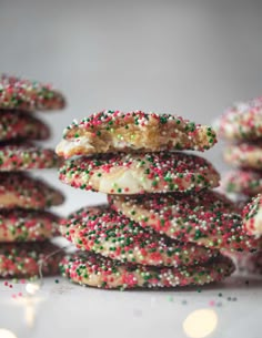 a stack of sprinkle covered cookies sitting on top of each other